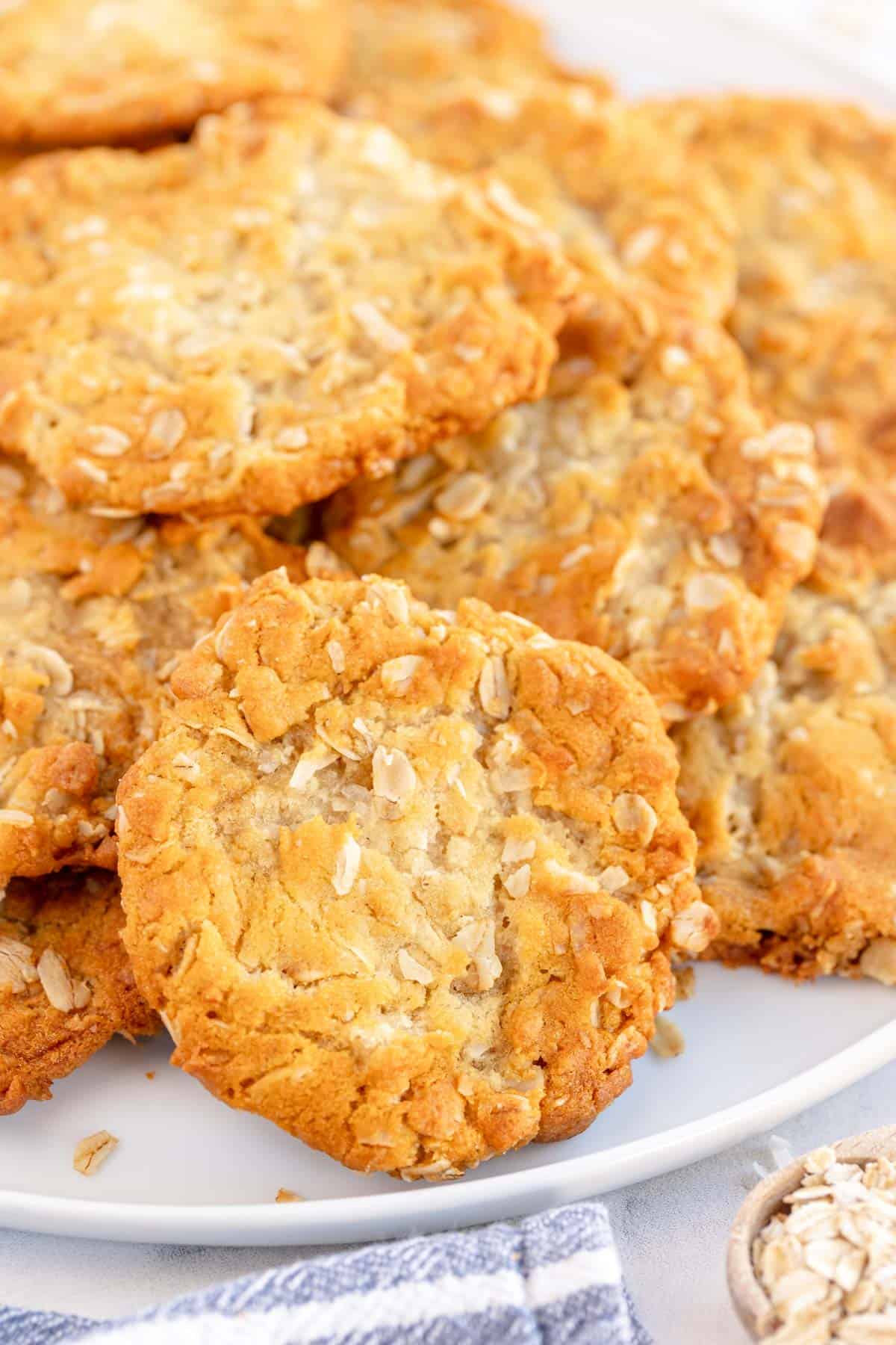 ANZAC Biscuits on a white plate.