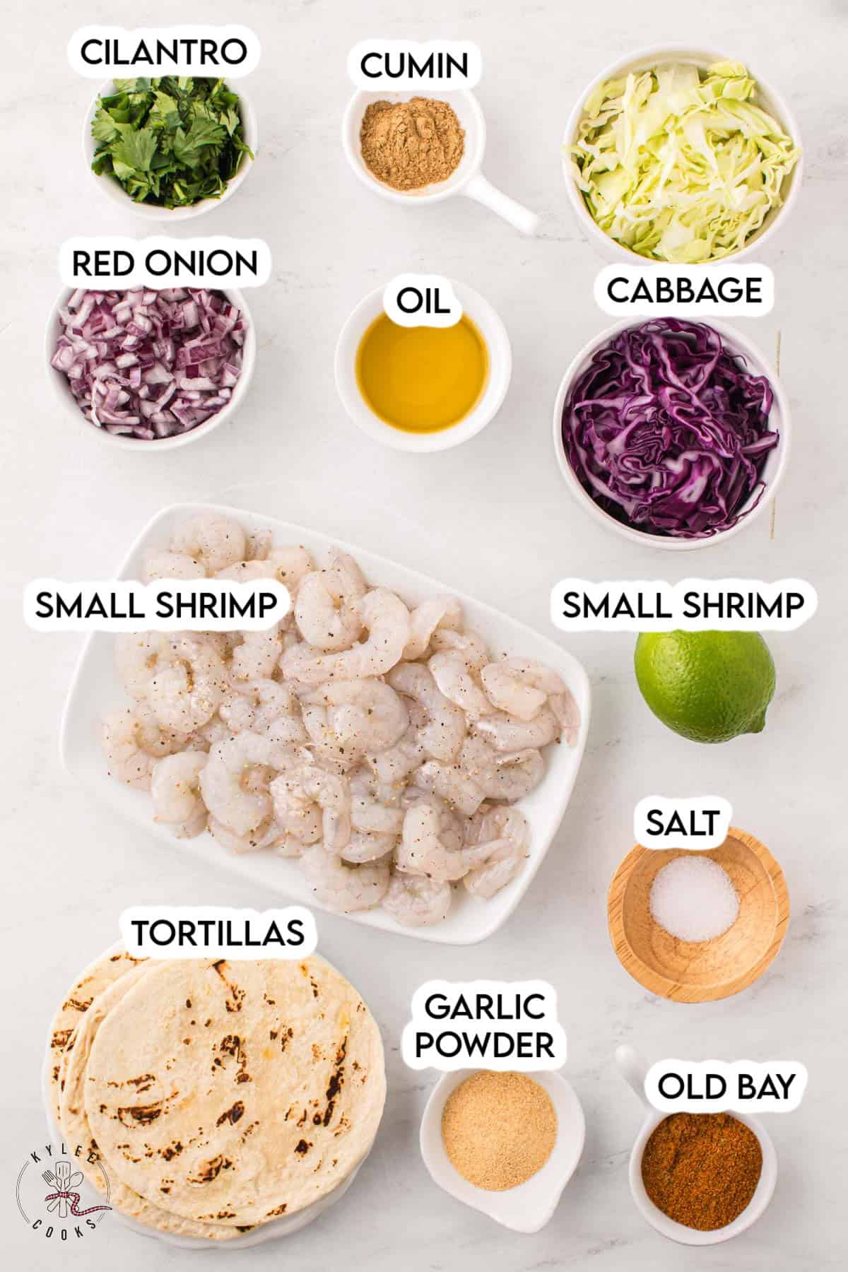 ingredients to make shrimp tacos laid out and labeled.