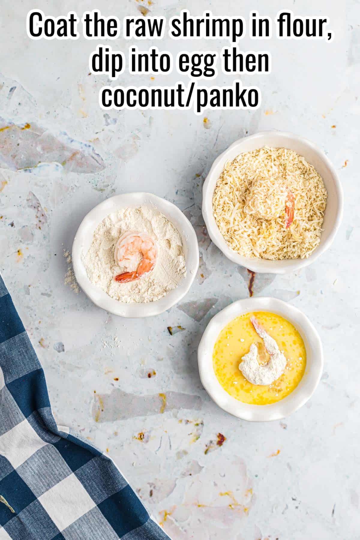 3 bowls with flour, egg and breadcrumbs showing the breading process for coconut shrimp.