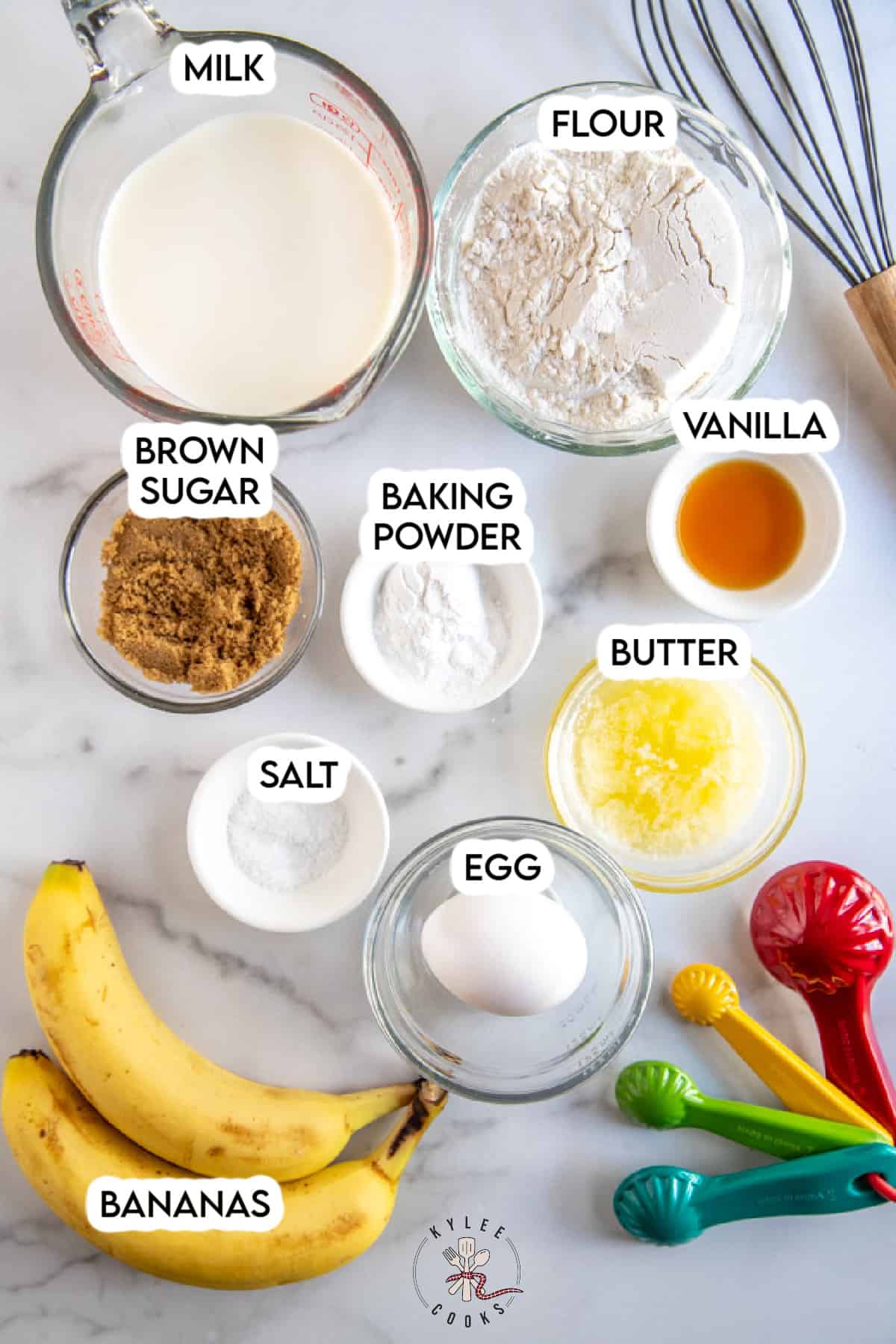 ingredients to make banana pancakes laid out and labeled.