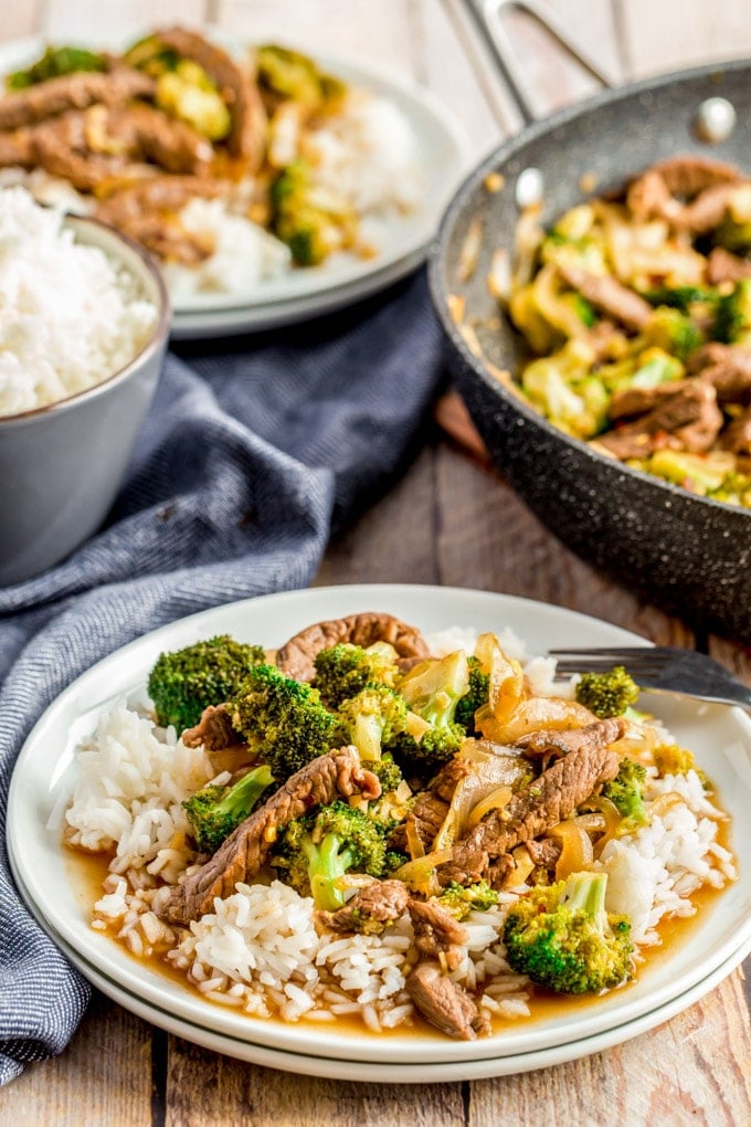 Beef and Broccoli on a white plate with rice