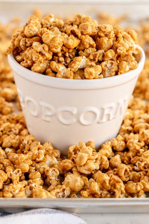 caramel corn in a white ceramic bowl.