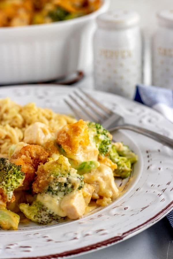 Chicken Divan Casserole on a white plate with a fork