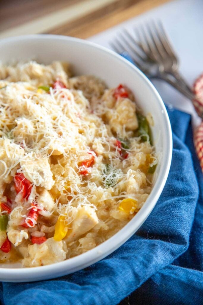 chicken risotto in a white bowl