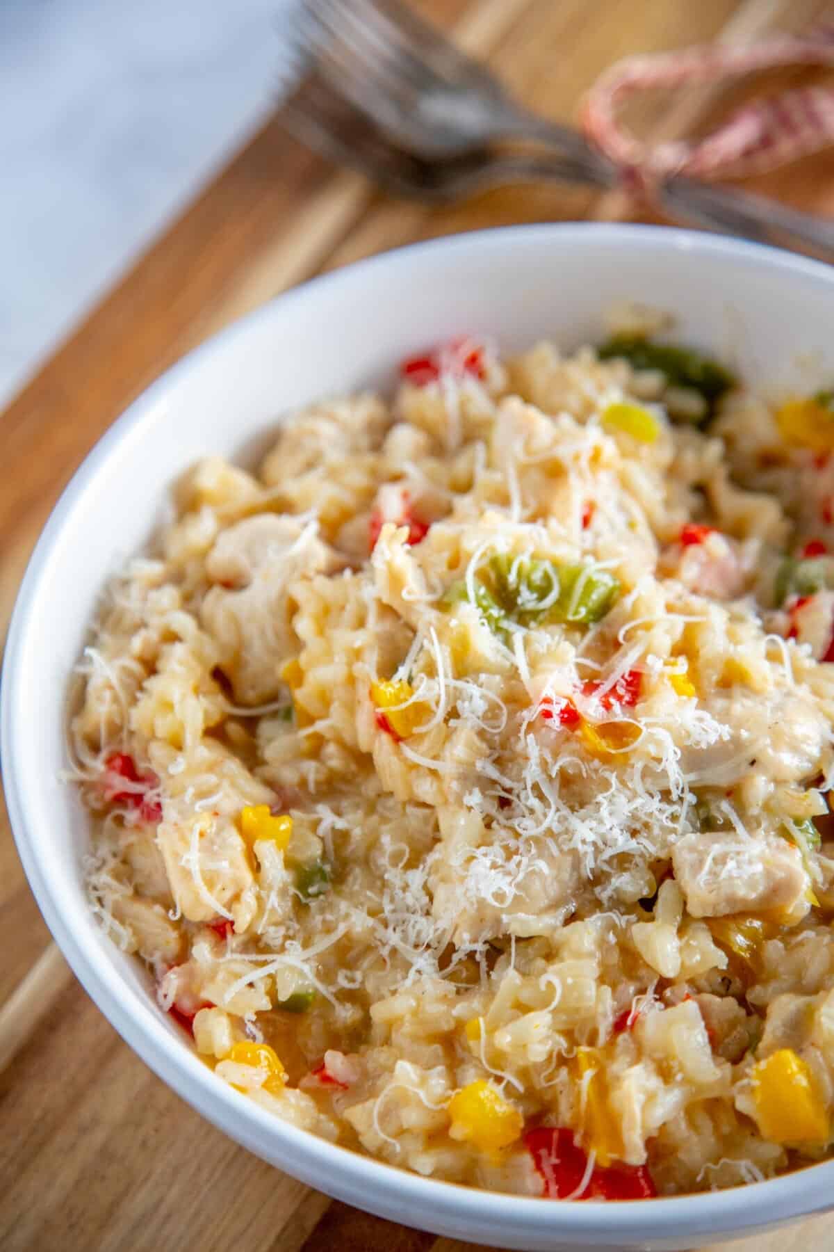 chicken risotto in a white bowl