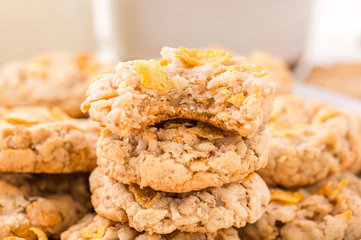 cornflake cookies with a bite taken out of one.