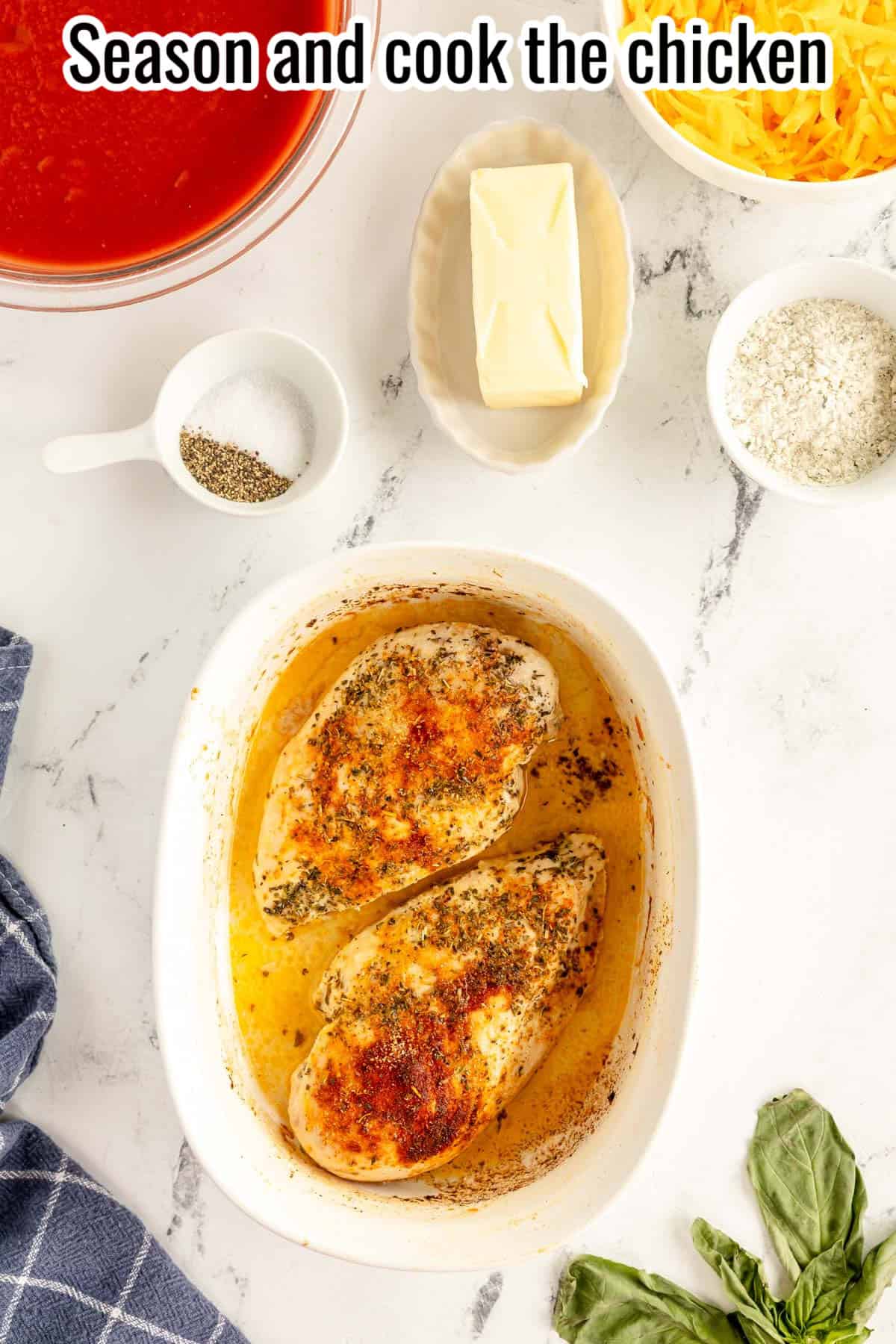 cooked chicken breasts in a white baking dish.