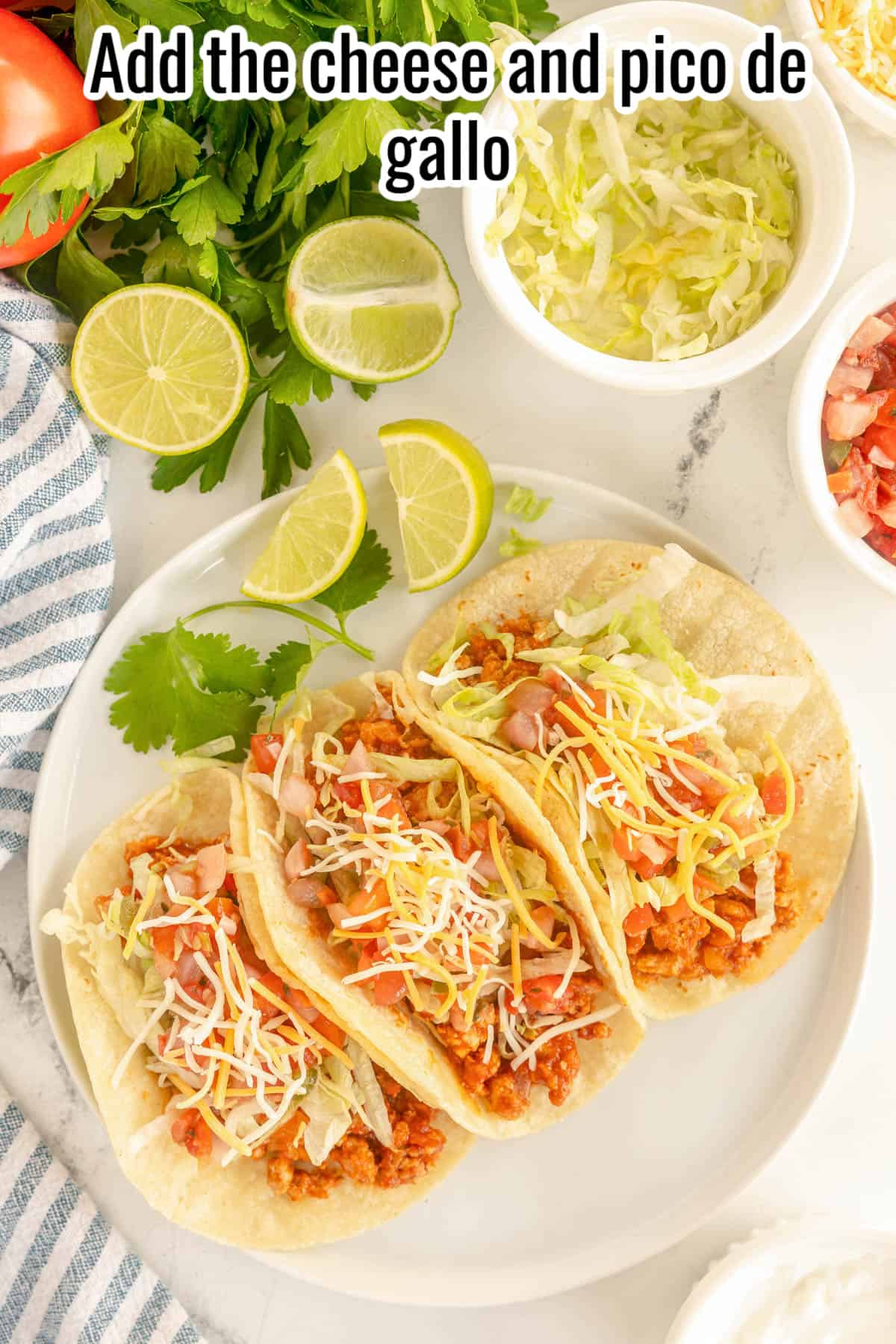 3 tacos with turkey meat, lettuce, cheese and pico de gallo.