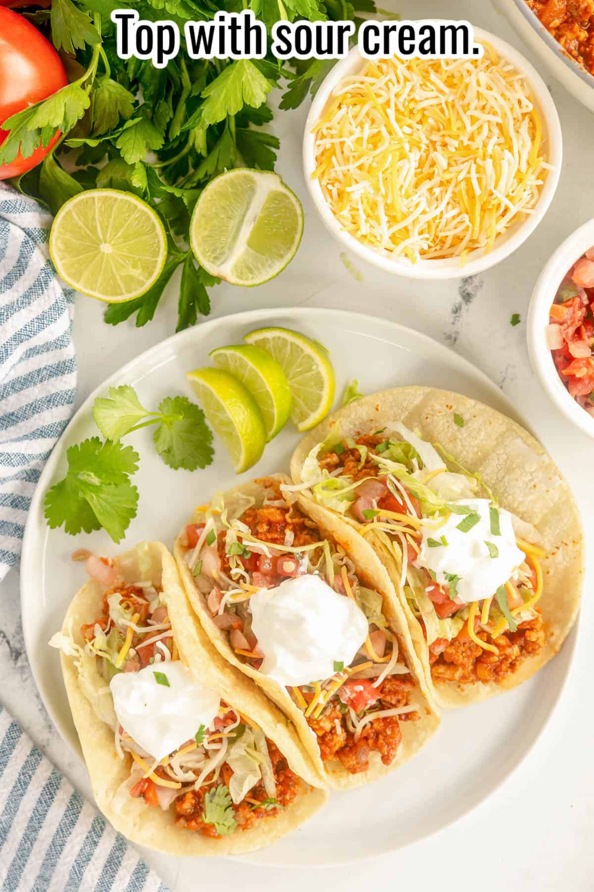 3 tacos with turkey meat, lettuce, cheese, pico de gallo and sour cream.