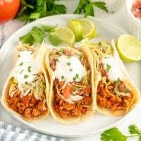 3 turkey tacos on a plate.