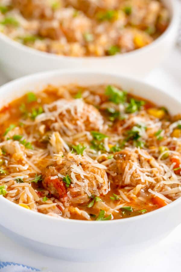 meatball soup in a white bowl