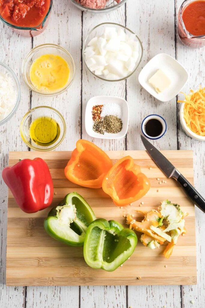 cut bell peppers on a wooden chopping board