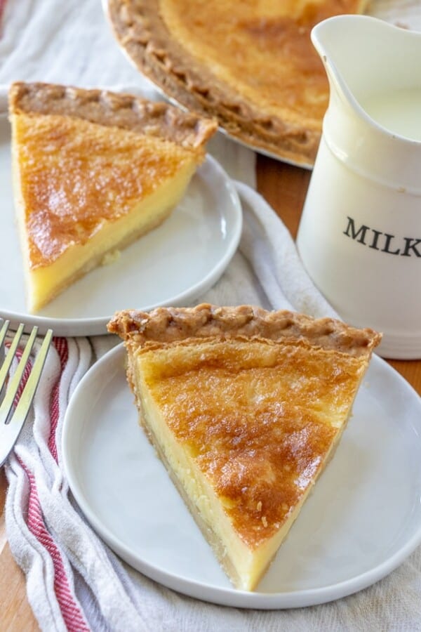 Buttermilk pie on a plate with a white and red napkin