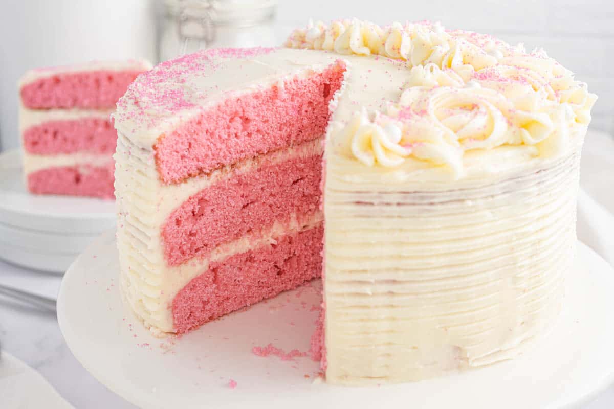 pink velvet cake cut open showing the layers inside.