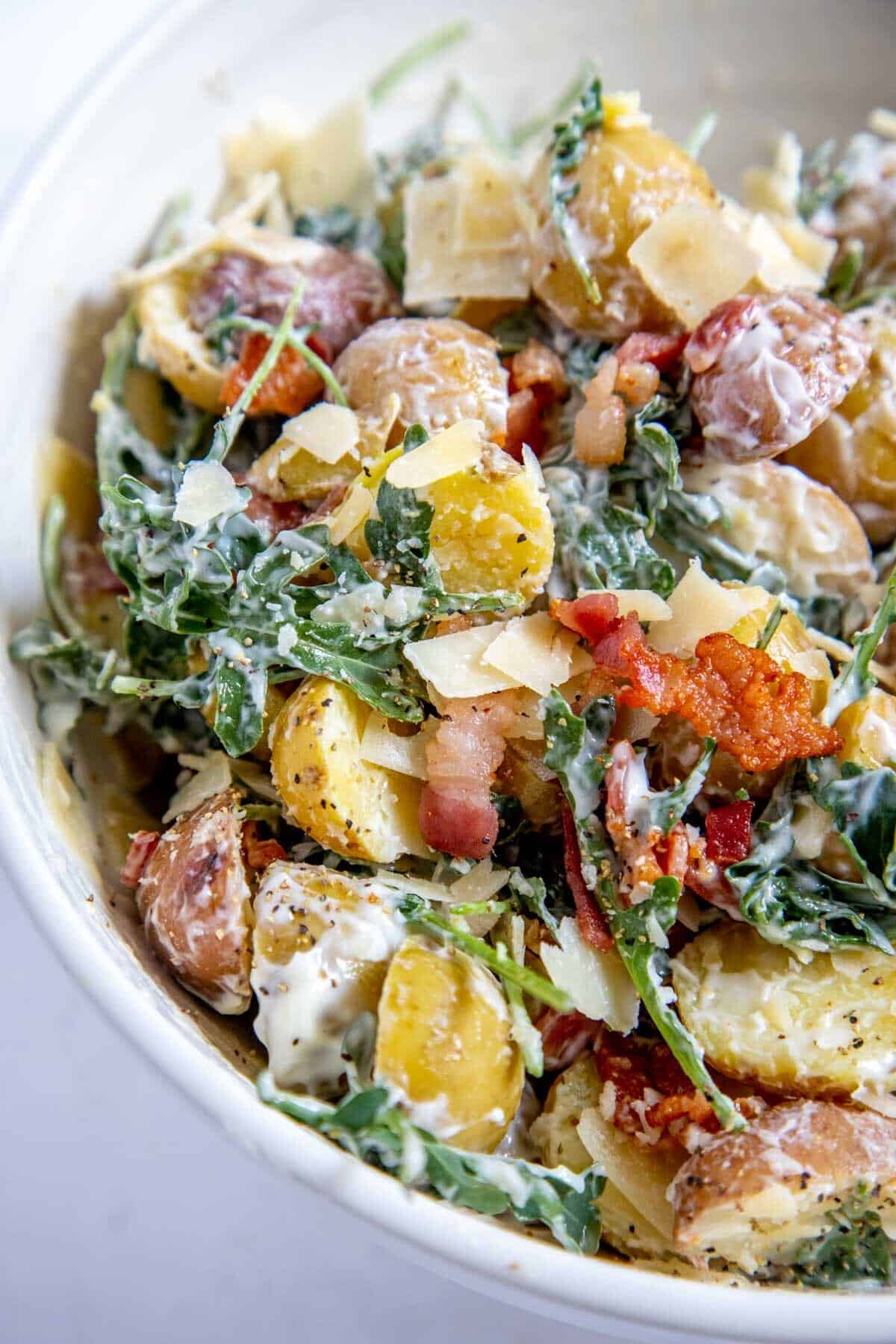 close up of potato salad in a white bowl