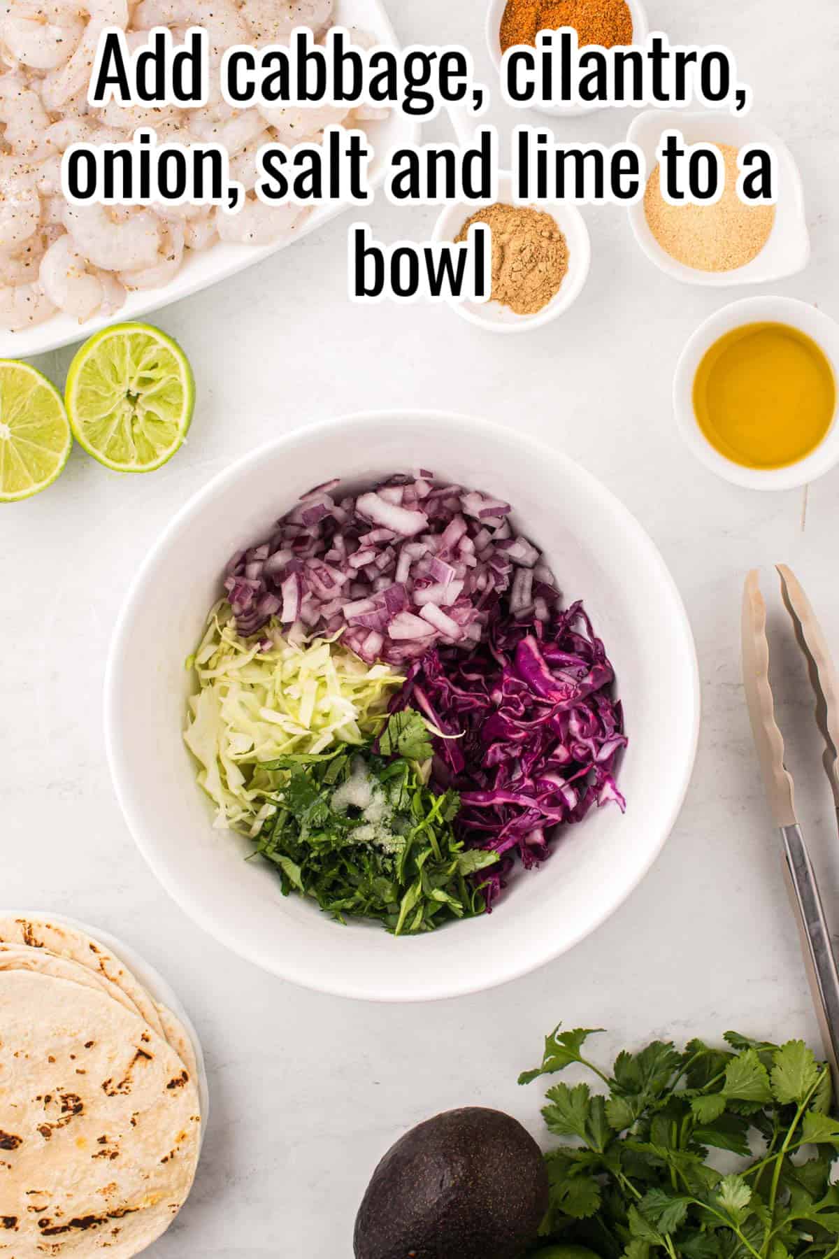 a white bowl with slaw ingredients laid in it.