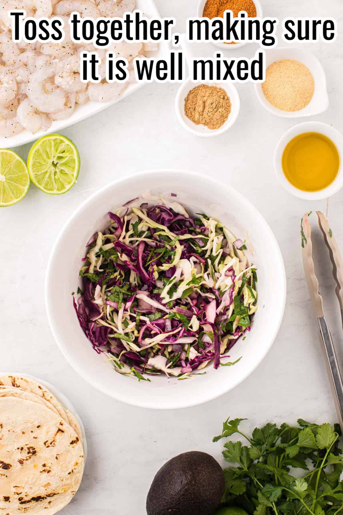 a white bowl with coleslaw.