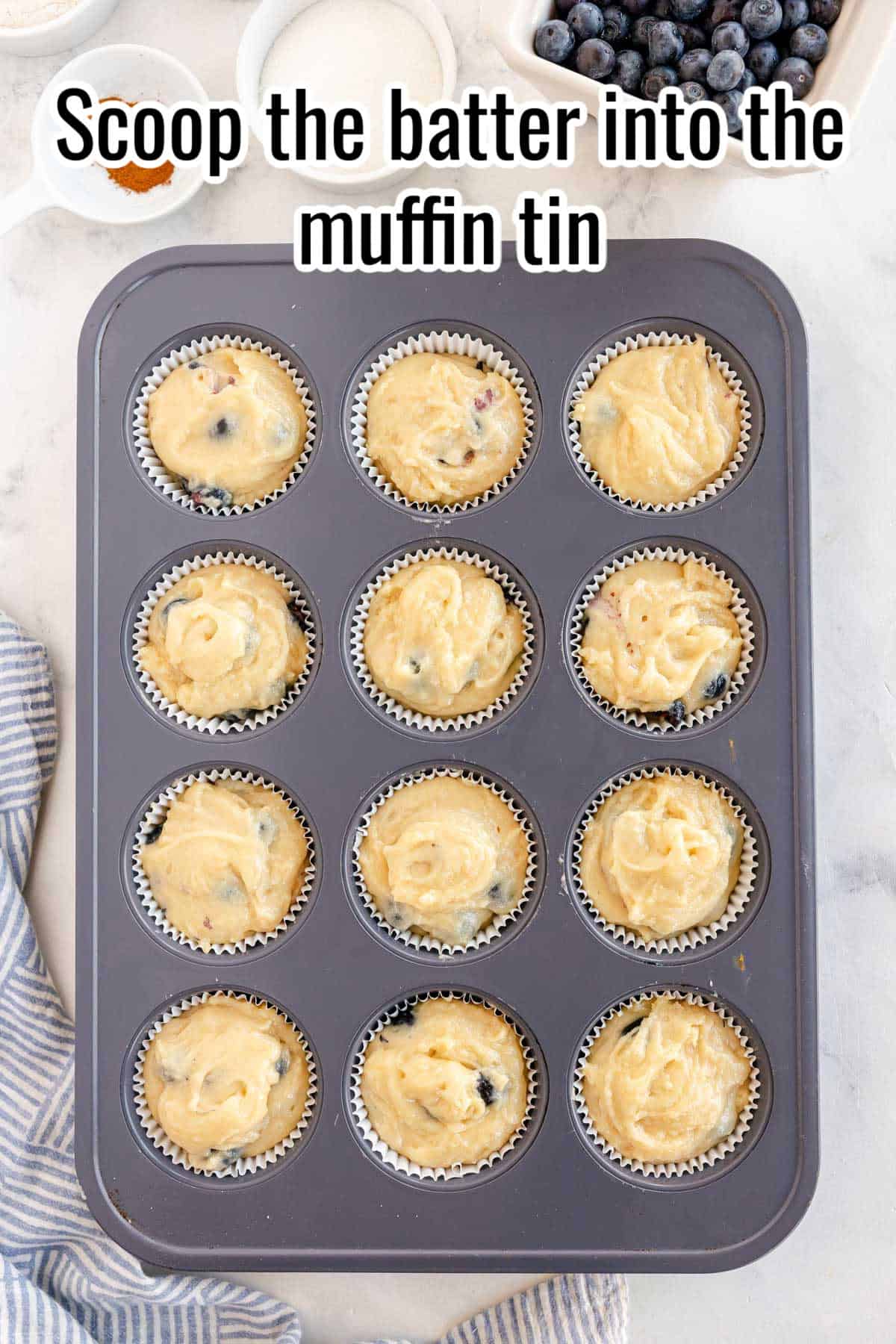a muffin tin with unbaked muffin batter in them.