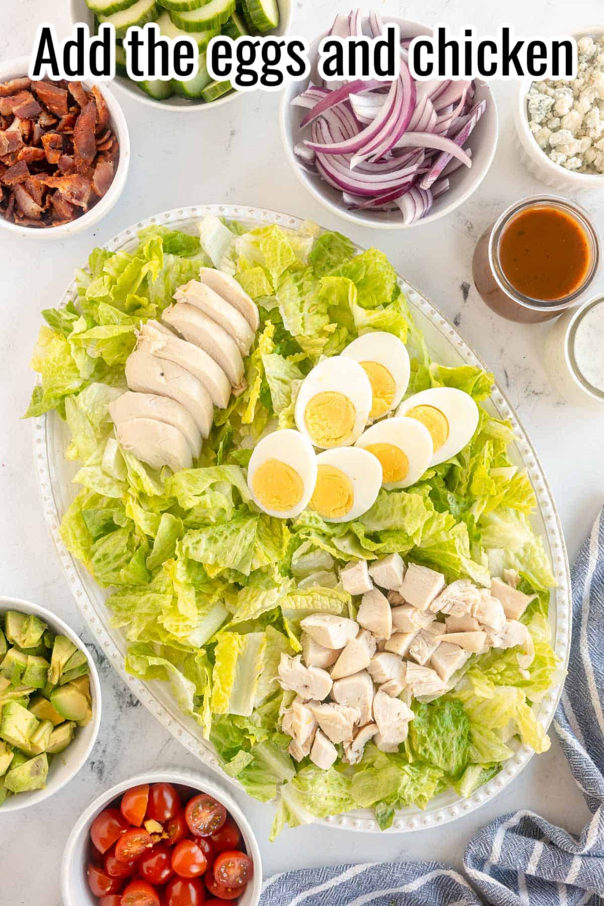Platter with lettuce, chicken and eggs.