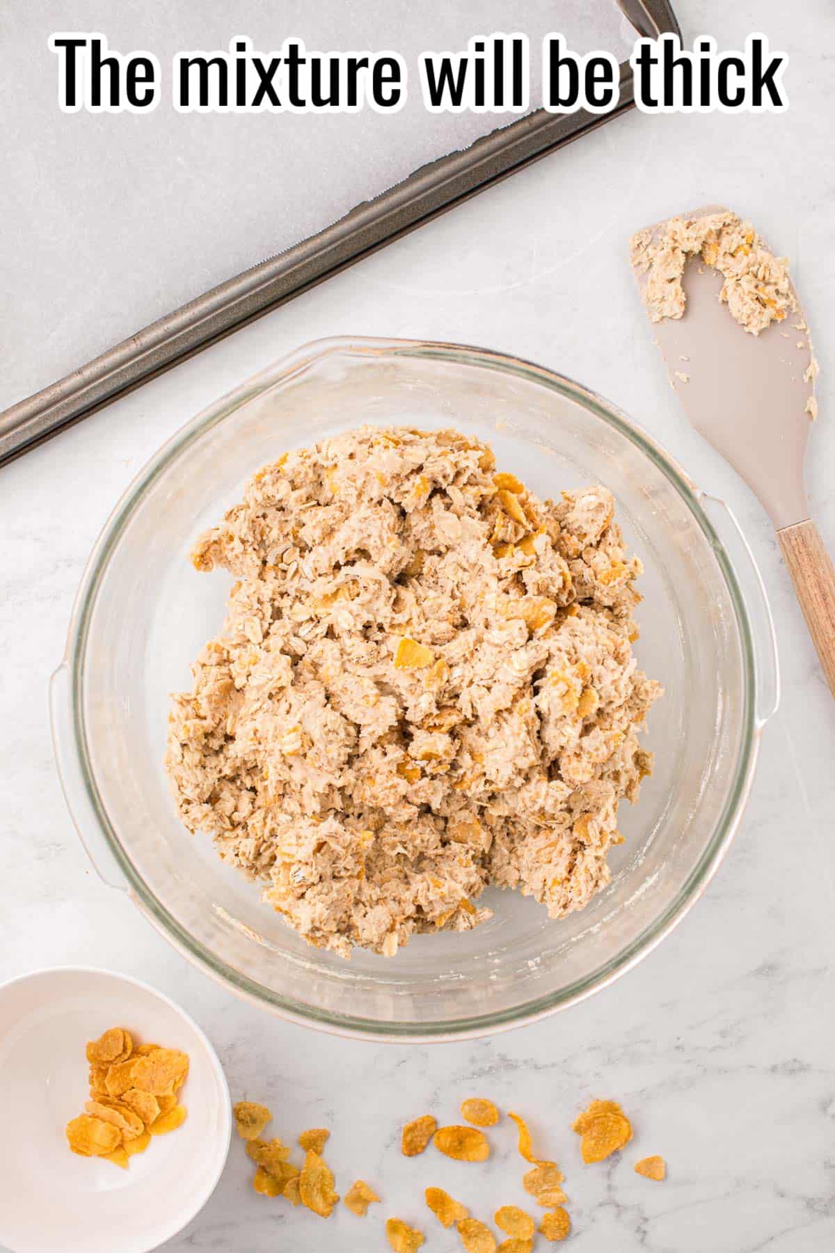 cornflake cookie dough in a glass bowl.