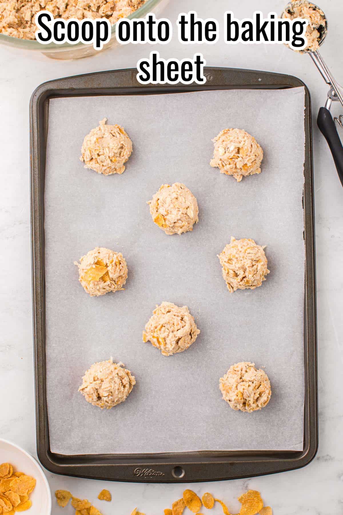 unbaked cookie dough on a baking sheet.