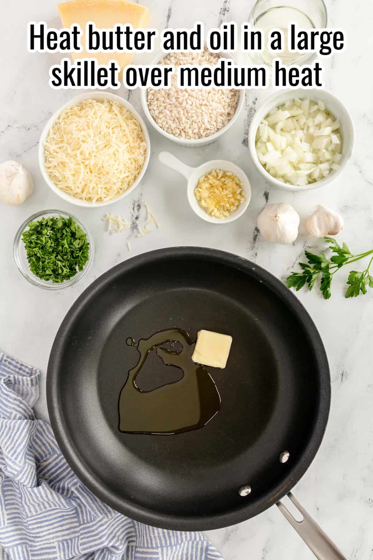 a black skillet with butter and olive oil in it.