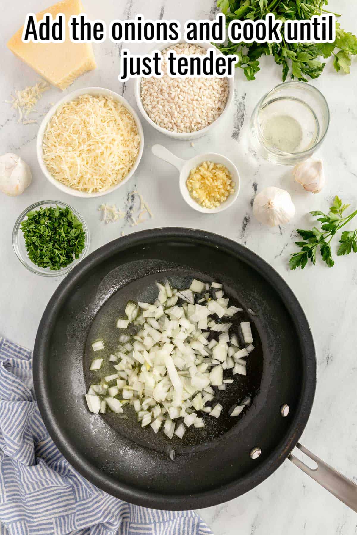 a black skillet with uncooked onion in it.