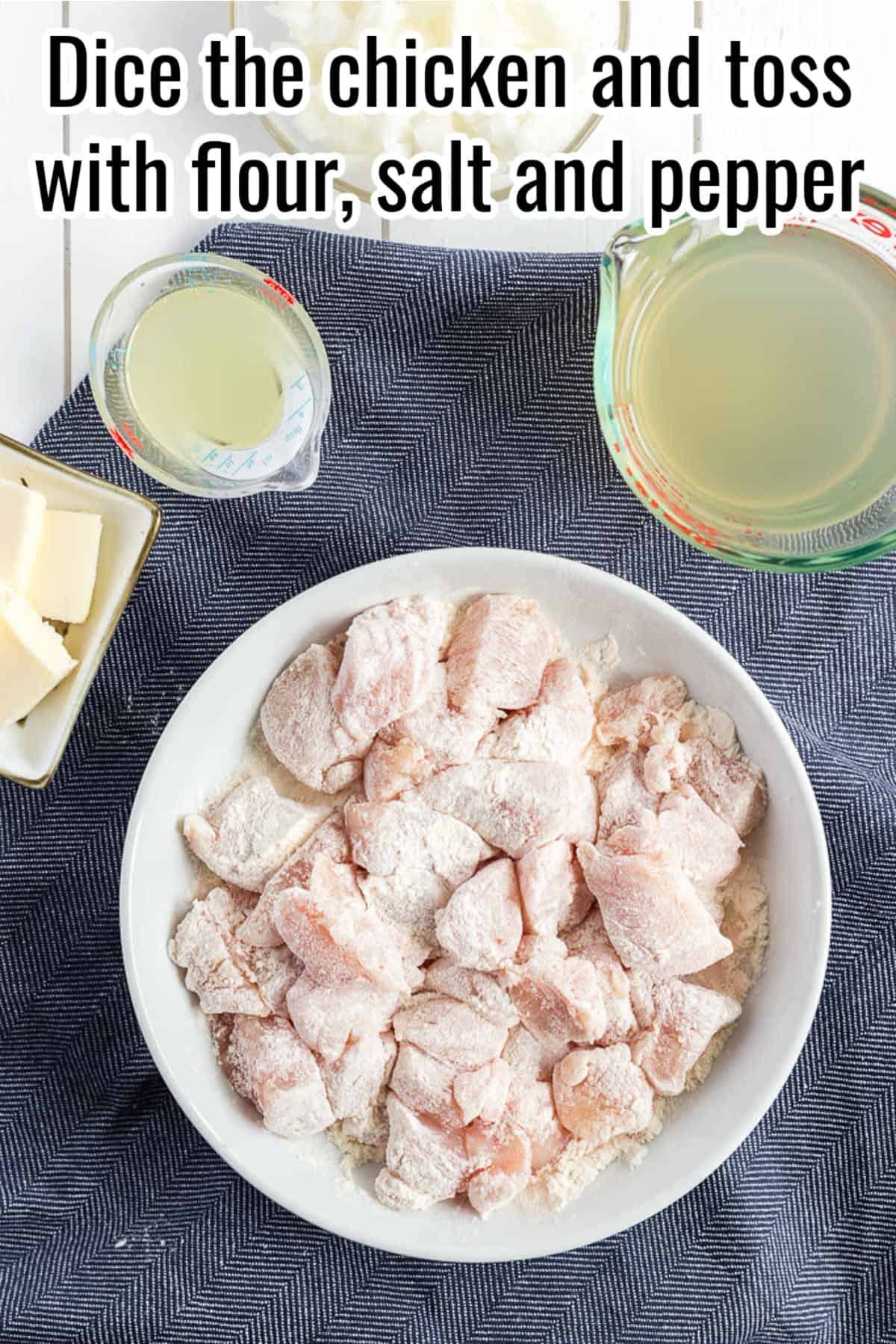 seasoned and floured chicken in a white bowl.