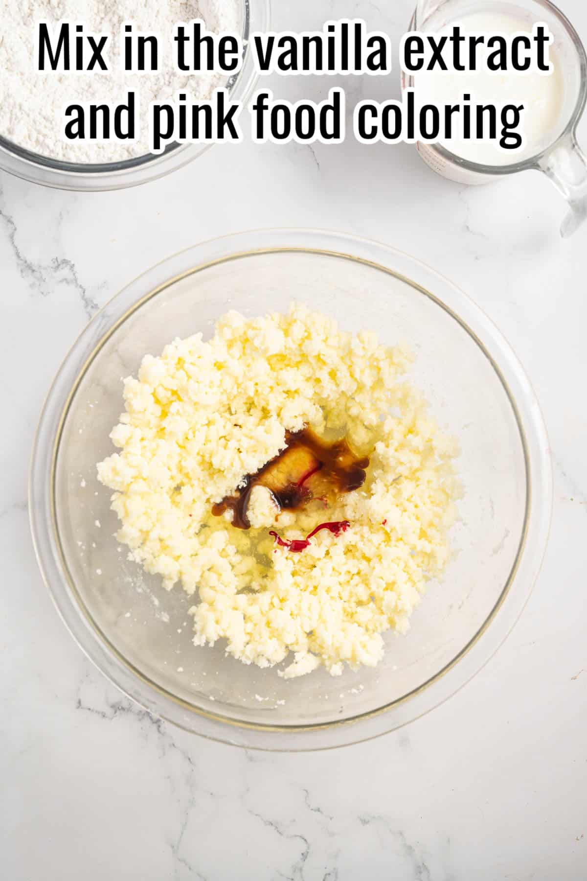 a glass bowl or creamed butter and sugar, with vanilla and pink coloring added.