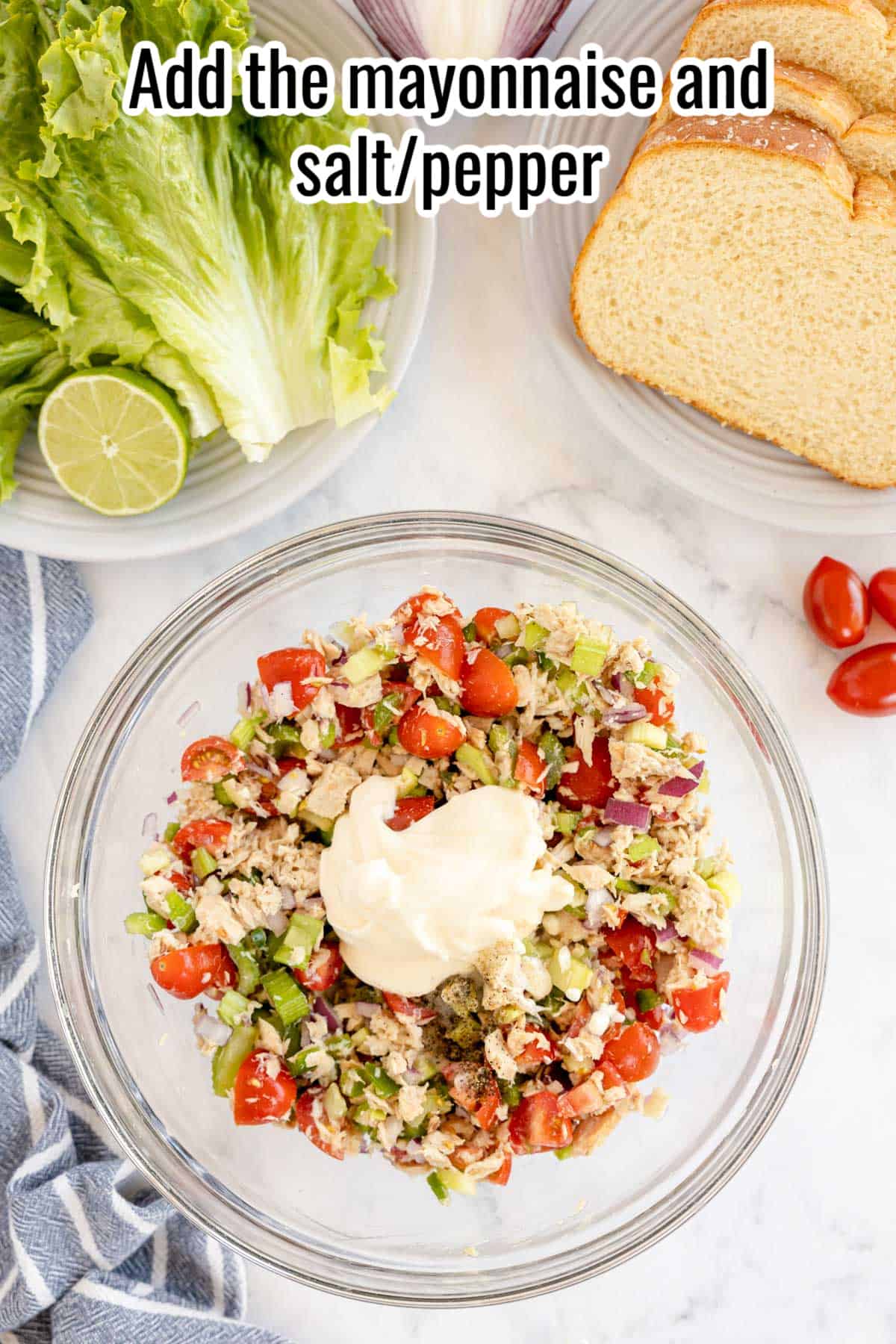 bowl of tuna salad with mayo on top.