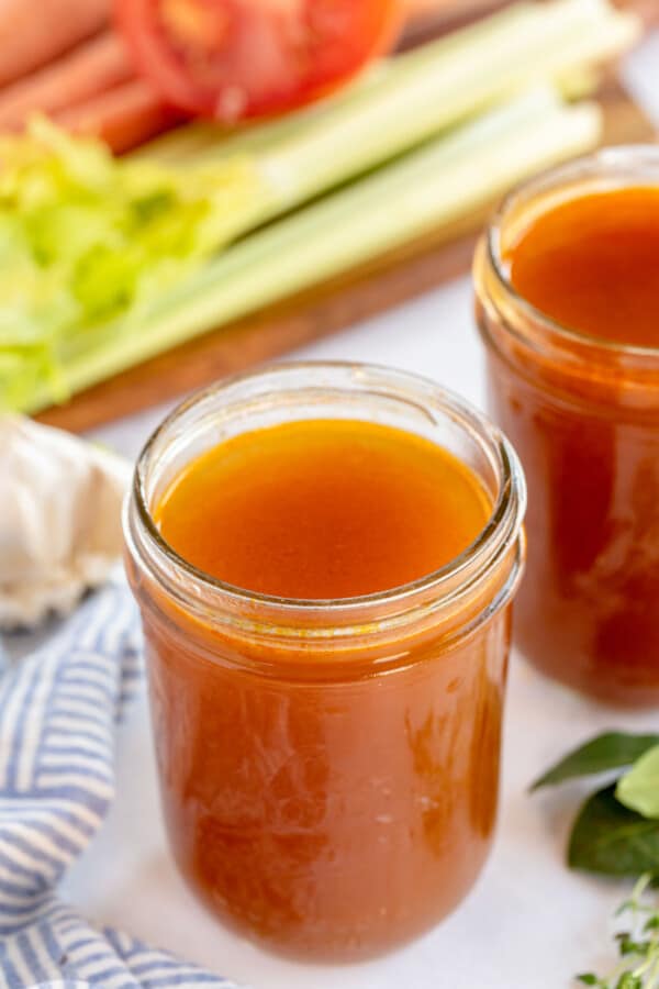 vegetable stock in a jar with celery