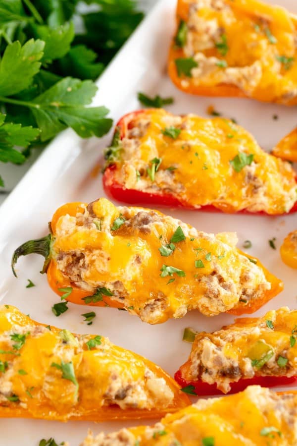 stuffed mini peppers on a baking sheet