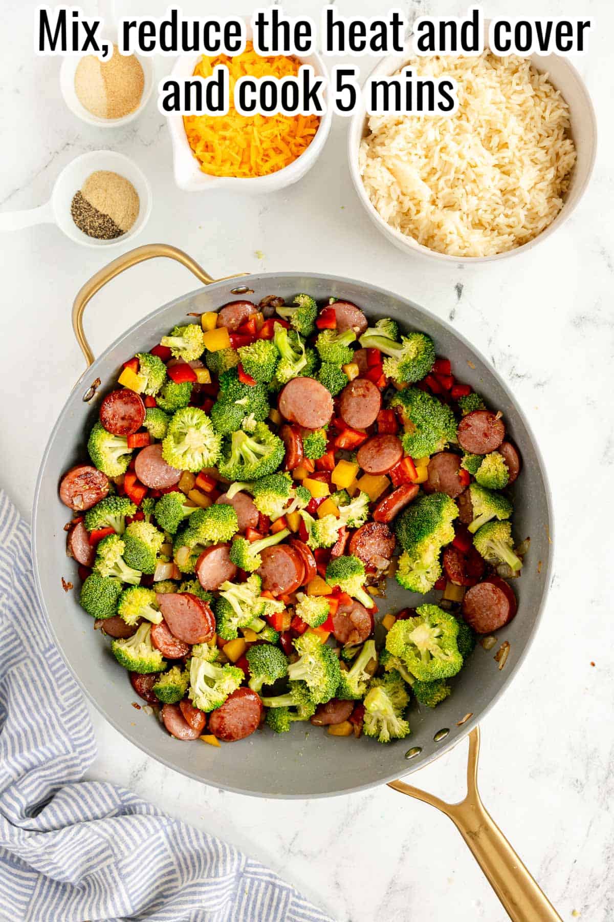 smoked sausage and veggies in a skillet.