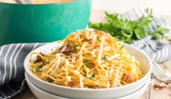 spaghetti carbonara in a white bowl