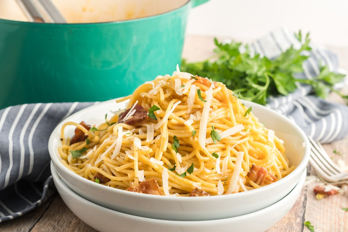 spaghetti carbonara in a white bowl