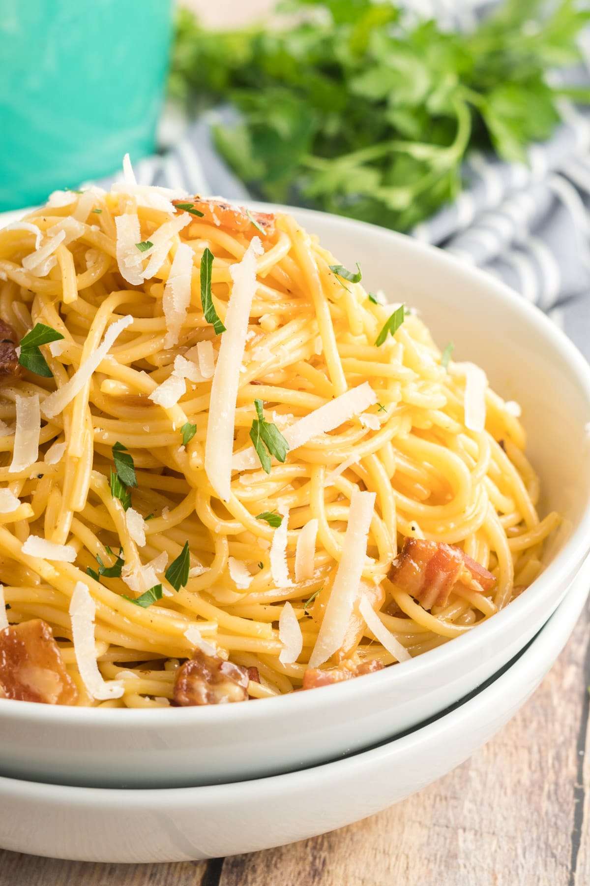 spaghetti carbonara in a white bowl