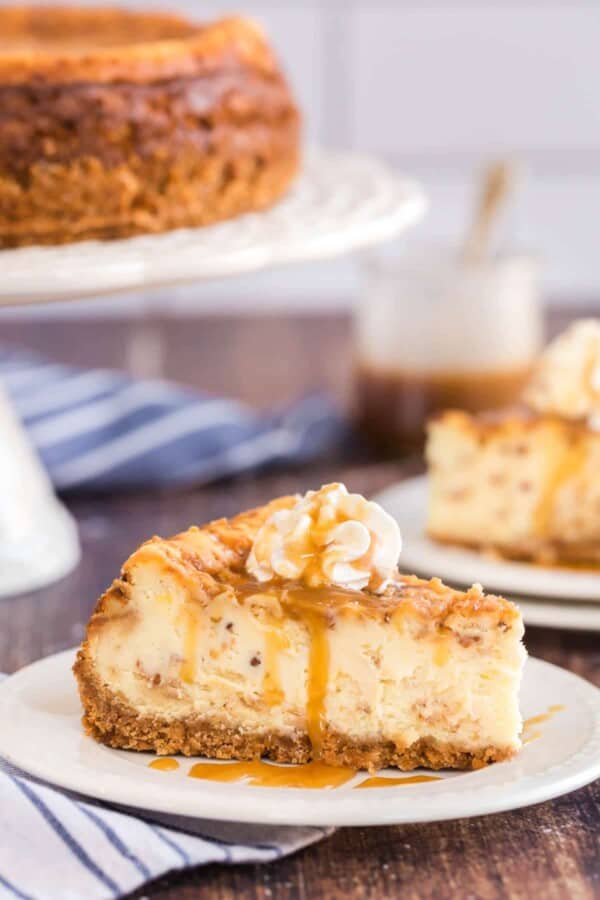 cheesecake on a white plate with a blue napkin