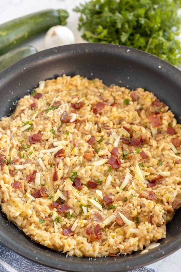 zucchini risotto in a skillet.